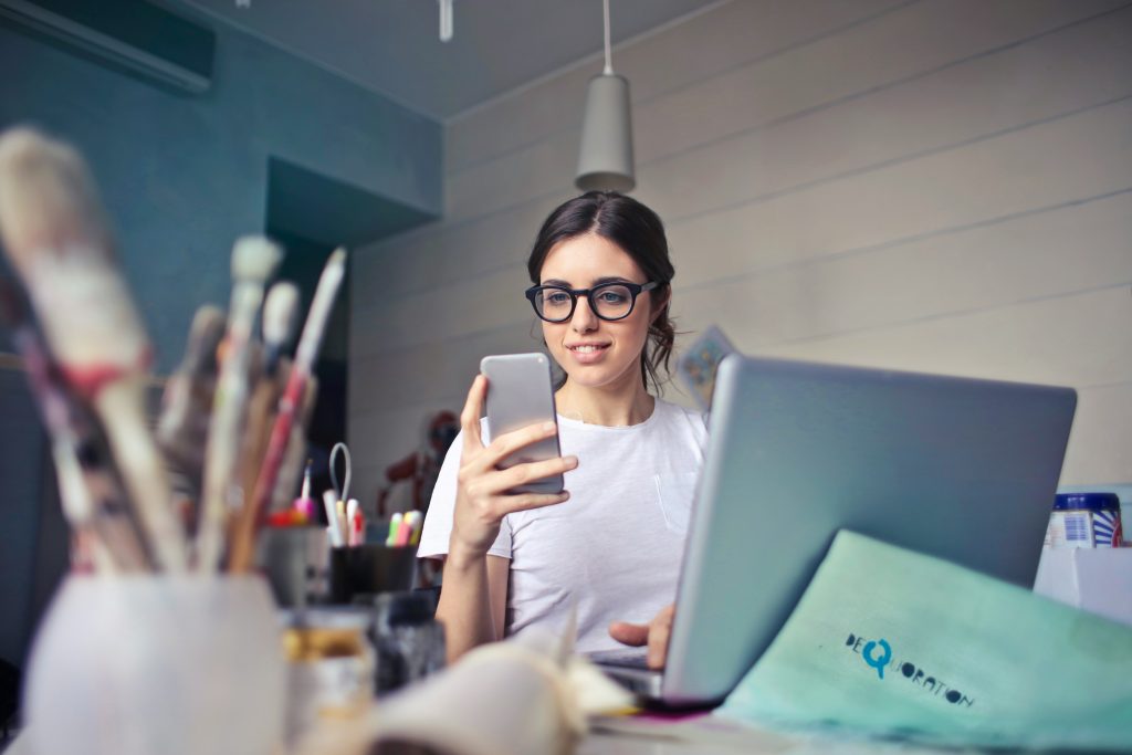 woman sitting with cellphone